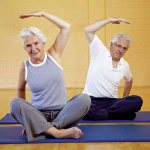 Elderly people doing yoga